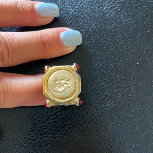 Gold tone coin like ring